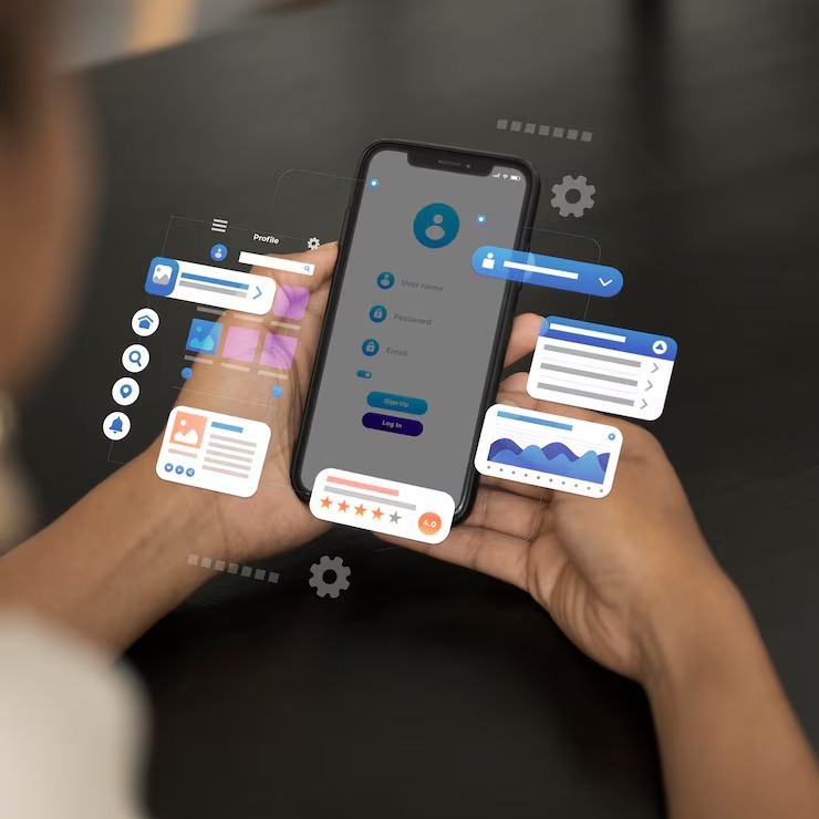 Hands holding a smartphone with a mobile app login screen and floating UI cards